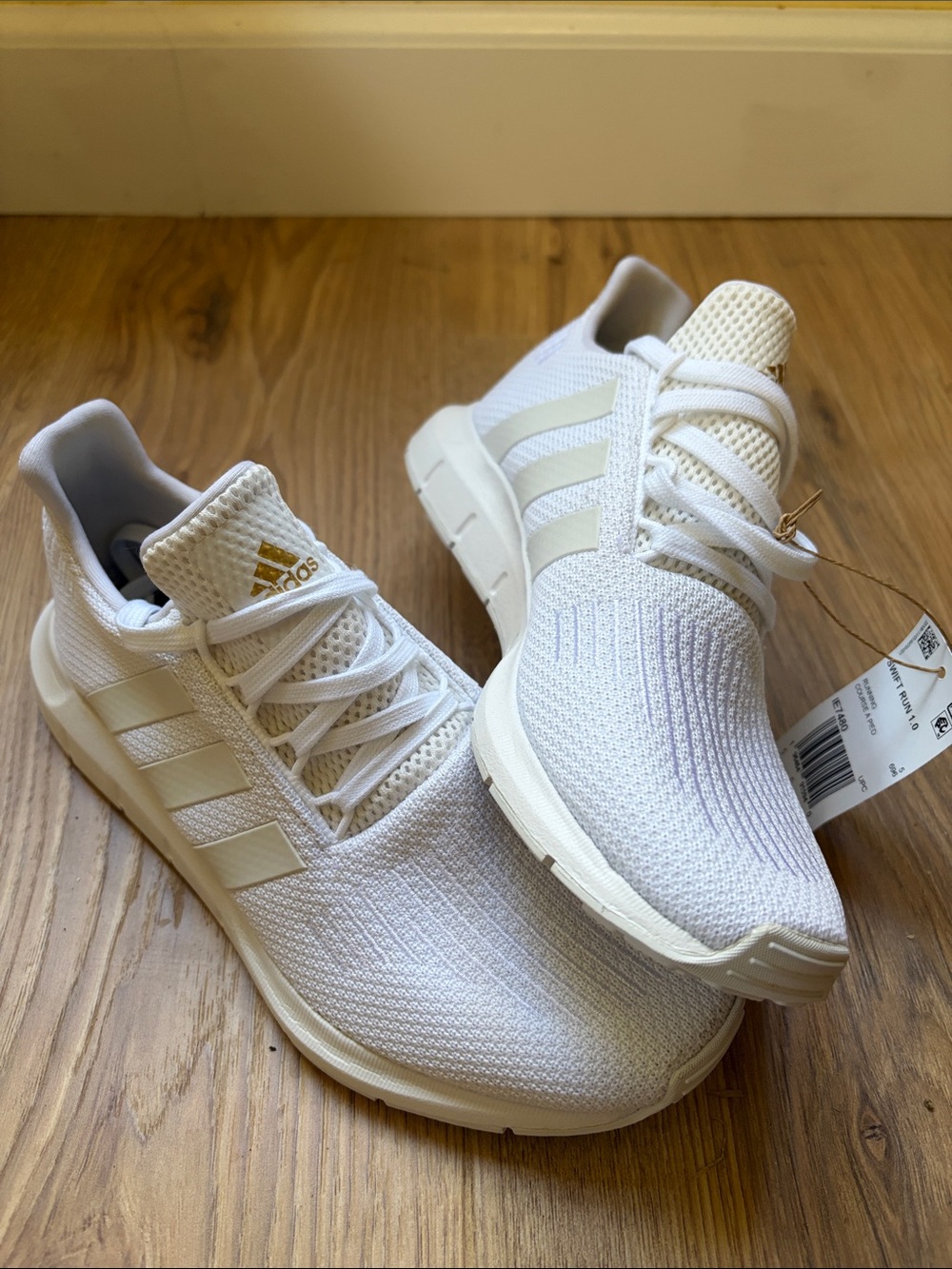 adidas Women’s White Knit Running Sneakers with Subtle Gold Logo